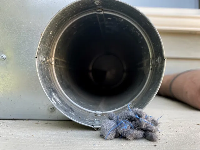 Hawaiian Gardens Dryer Vent Cleaning technician using specialized equipment to clear severe dryer vent blockage in Hawaiian Gardens